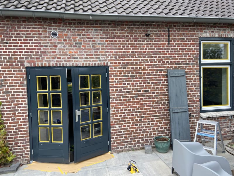 A darker coat of paint has been applied to both the double door and window