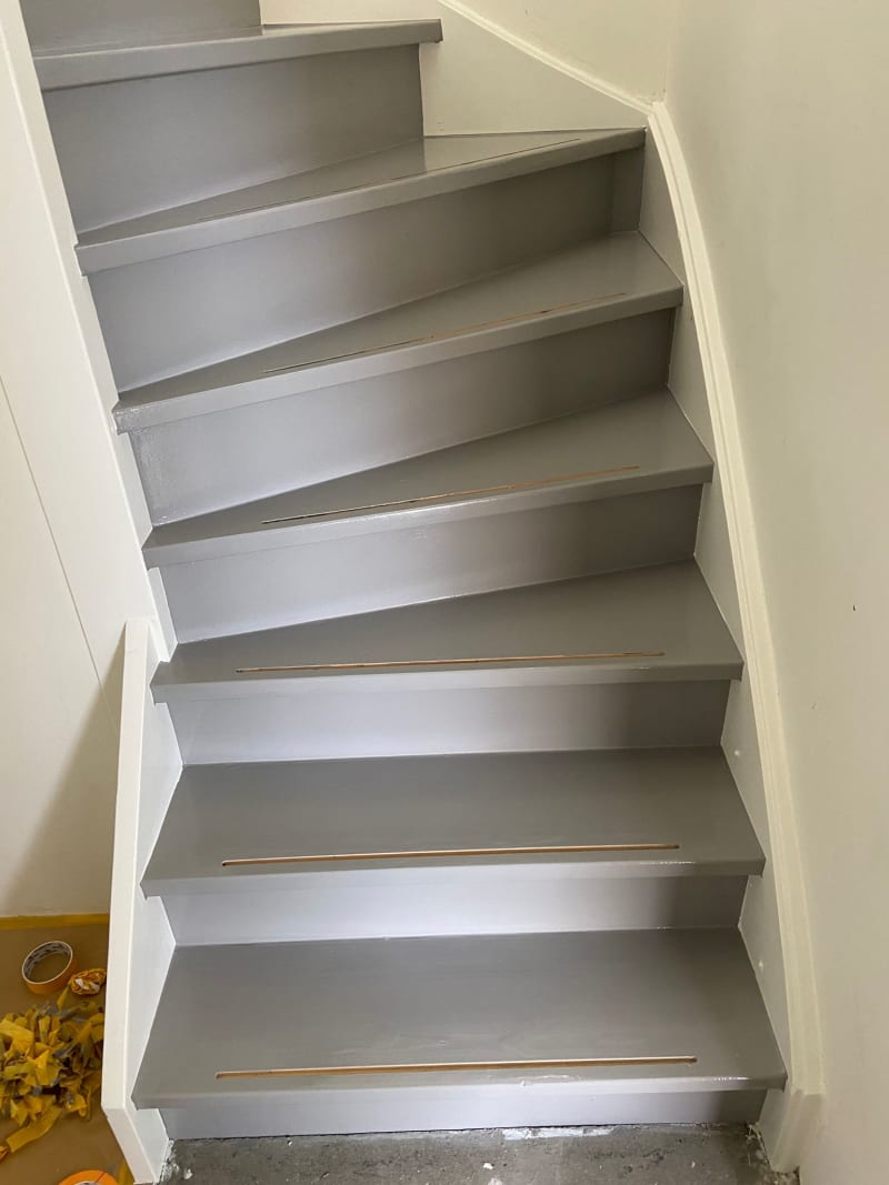 Finished stairs after a darker coat of paint has dried