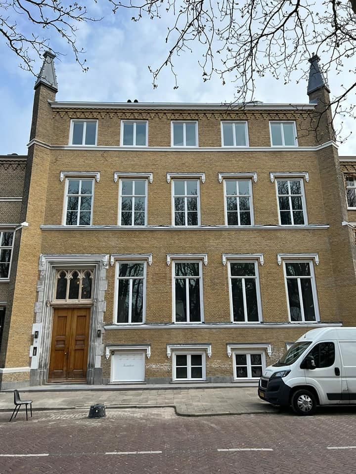 Building facade windows covered with monumental glass