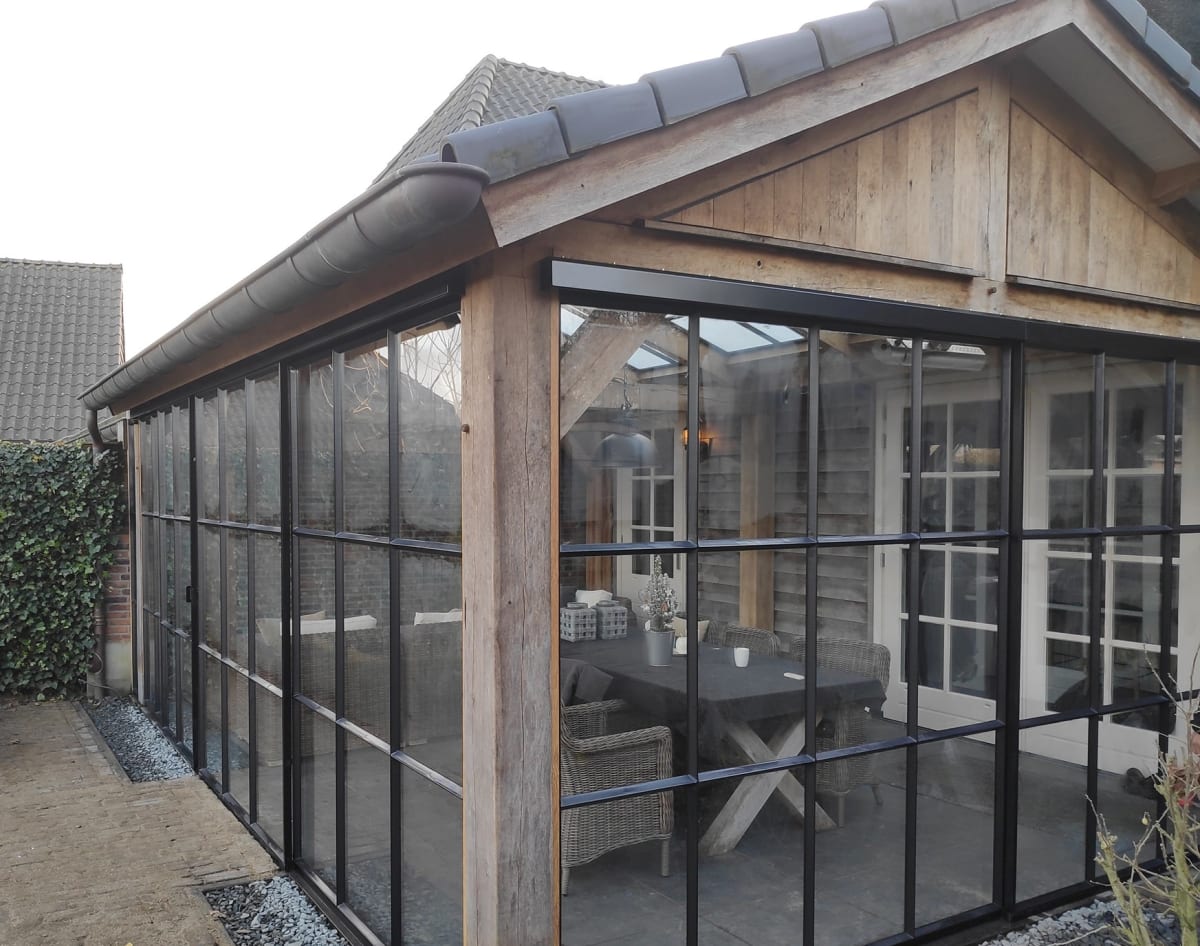 Exterior view of glass and steel-frame walls for a patio