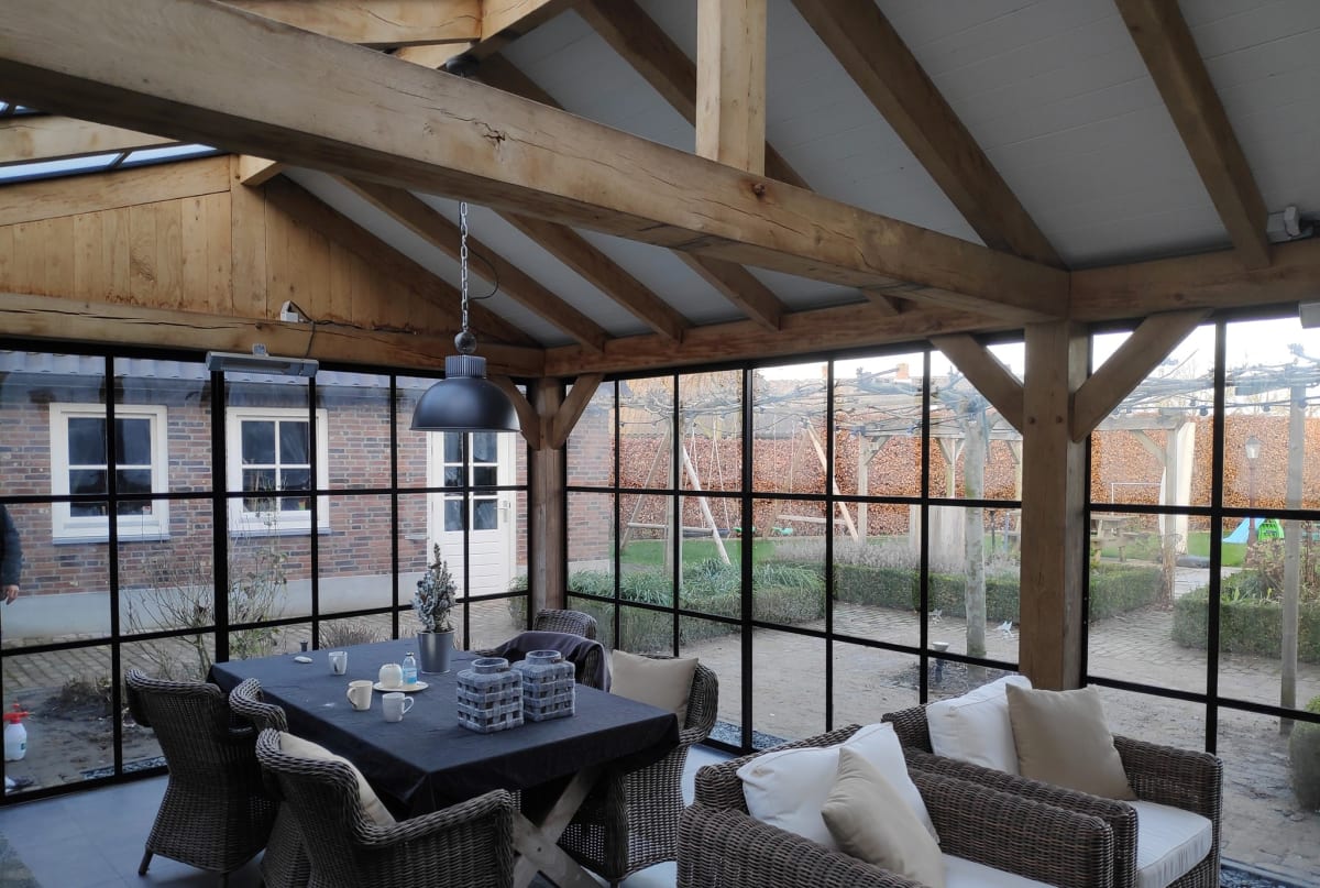 Interior shot showing glass and steel-frame walls for a patio